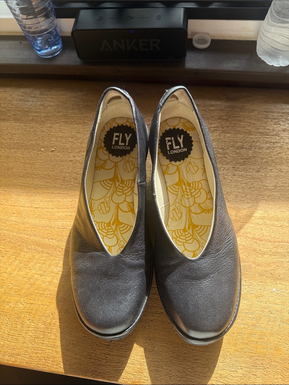 Fly London Black Leather Slip-On Flats with Yellow-Patterned Insole